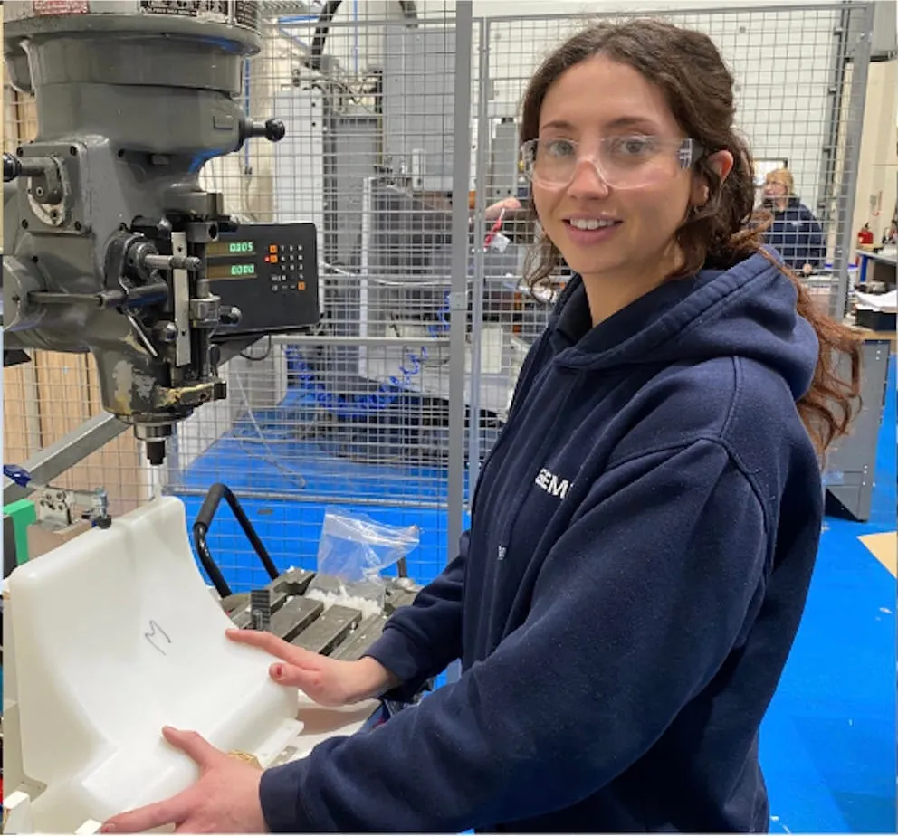A Gemini team member operating a pillar drill on the shop floor