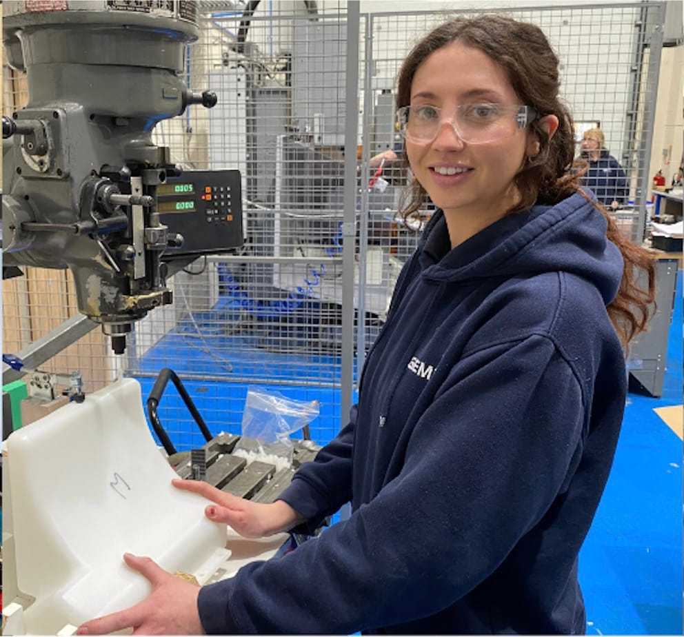 A Gemini team member operating a pillar drill on the shop floor