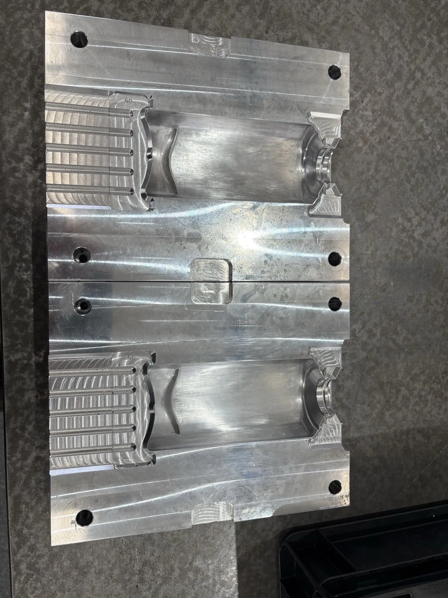 A machined aluminium injection mould tool cavity in Gemini's tool room