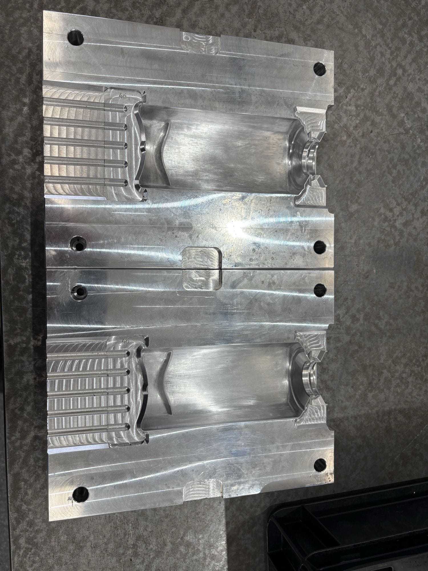 A machined aluminium injection mould tool cavity in Gemini's tool room