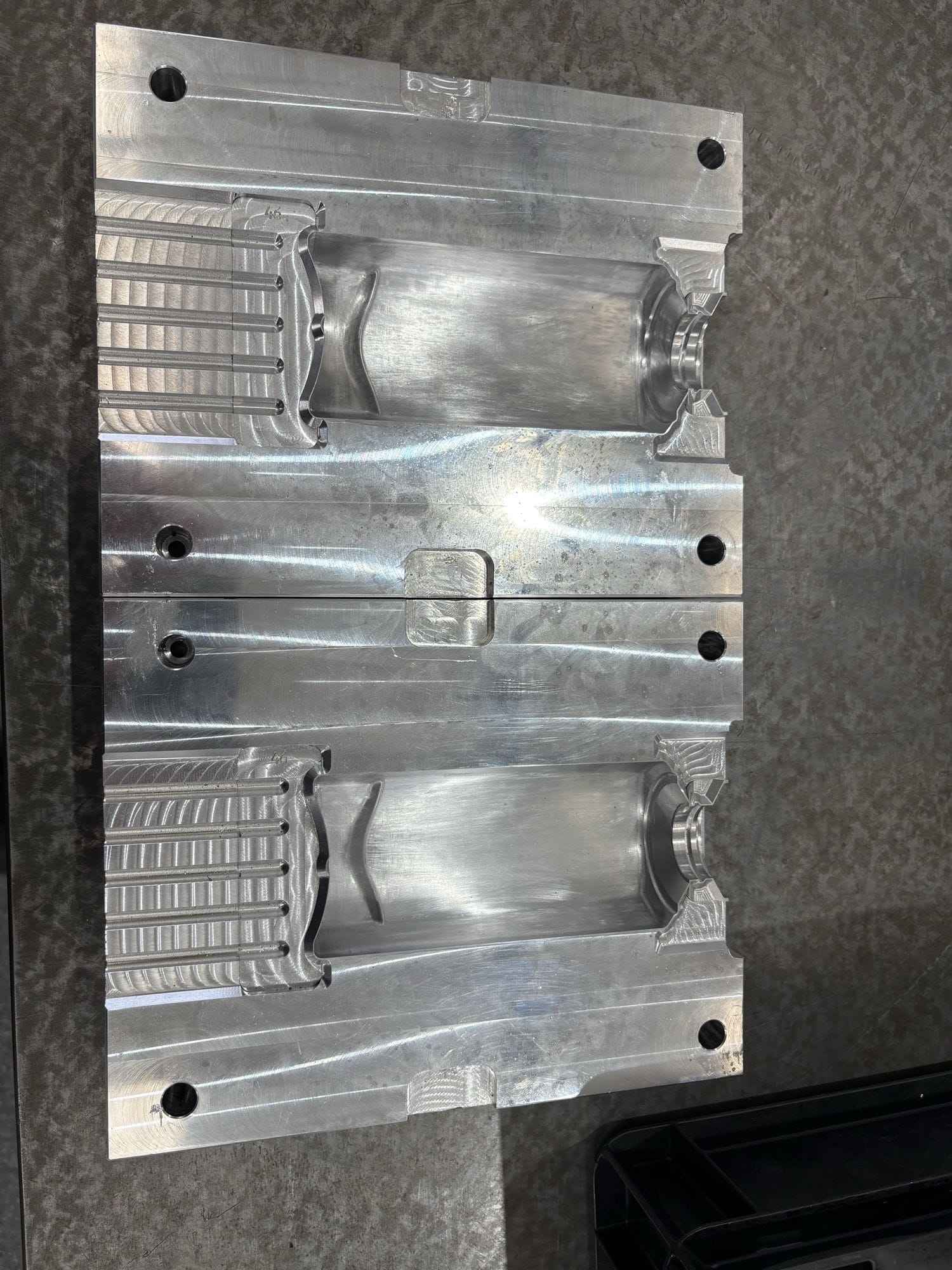 A machined aluminium injection mould tool cavity in Gemini's tool room